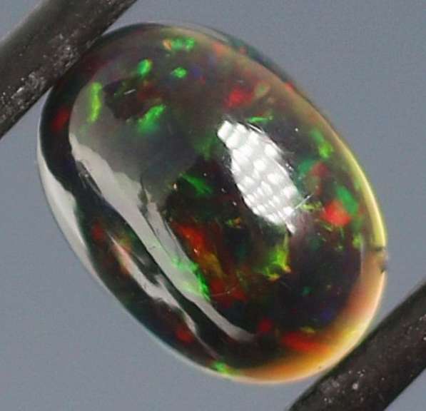 Glistening 1.63ct fiery flashing Welo Black Opal