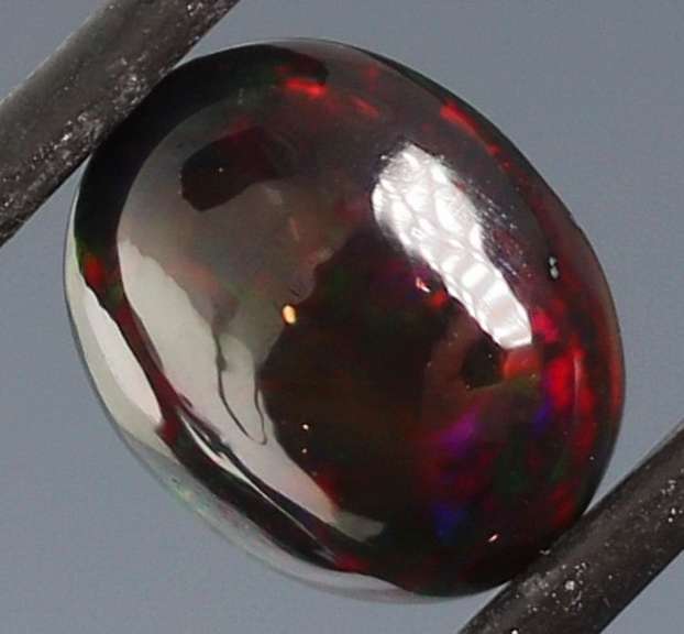 Tremendous 2.46ct red and green flashing Black Opal