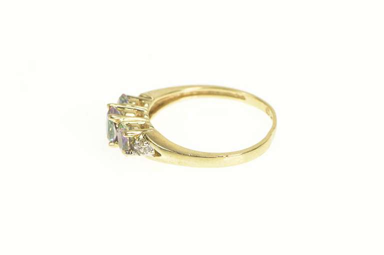 10K Yellow Gold Three Stone Oval Mystic Topaz CZ Accent Ring