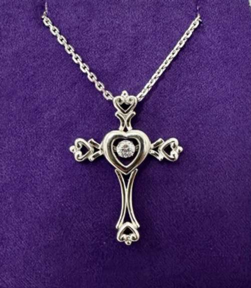 Platinum over 925 non Tarnish sterling silver Pendant with center dancing stone.