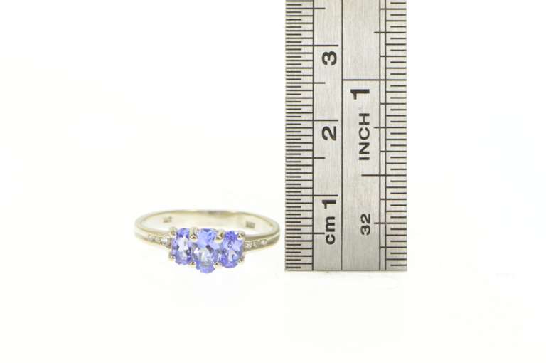 14K White Gold Oval Tanzanite Three Stone Diamond Accent Ring