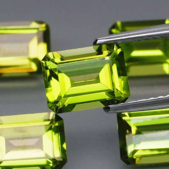 Emerald cut Unheated! 7.65ct Peridot set