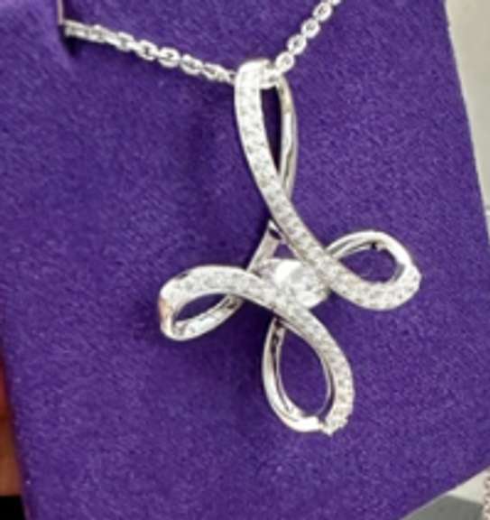 Big cross pendant platinum over non tarnish Sterling silver with dancing simulated Diamond