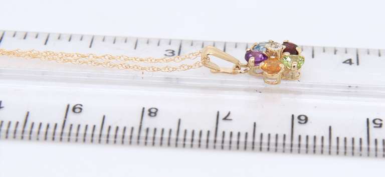 Attractive Yellow Gold Multi Gemstone Flower Pendant on Chain