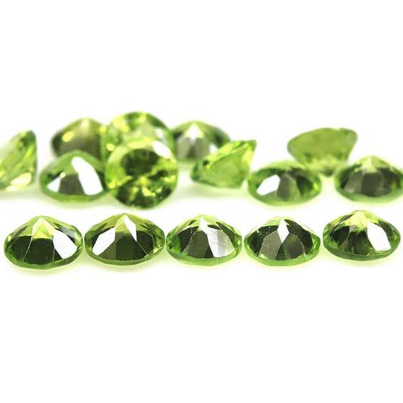 Fantastic 12.16ct 6mm round cut Peridot set