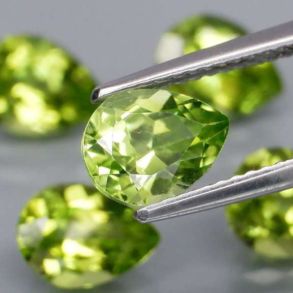 Dazzling 6.02ct untreated apple green Peridot set