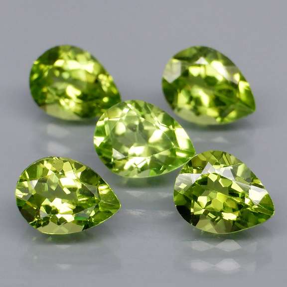Dazzling 6.02ct untreated apple green Peridot set