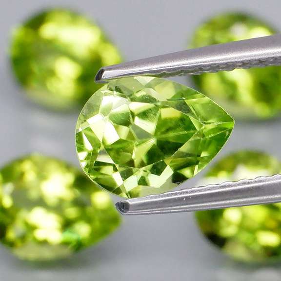 Dazzling 6.18ct untreated apple green Peridot set