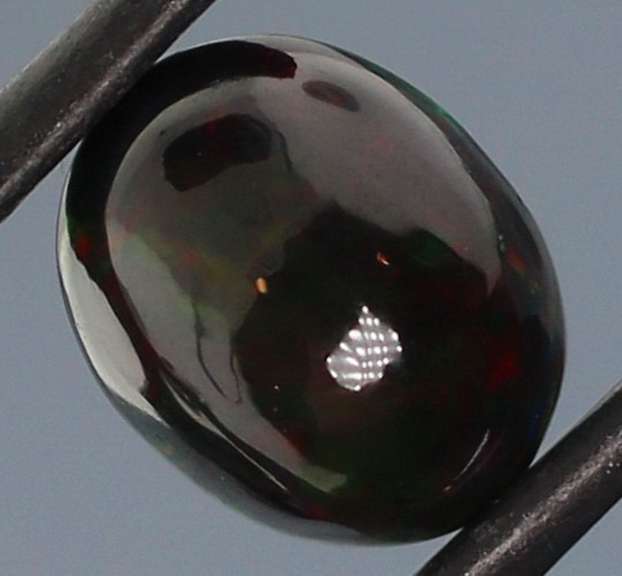 Tremendous 2.46ct red and green flashing Black Opal