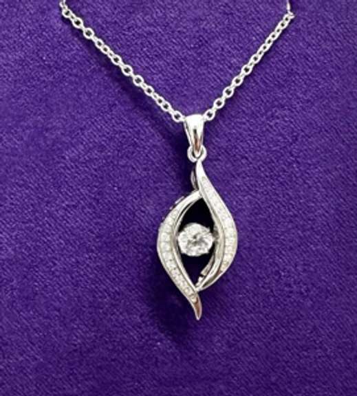 Platinum over 925 non Tarnish Sterling Silver with dancing simulated Stone