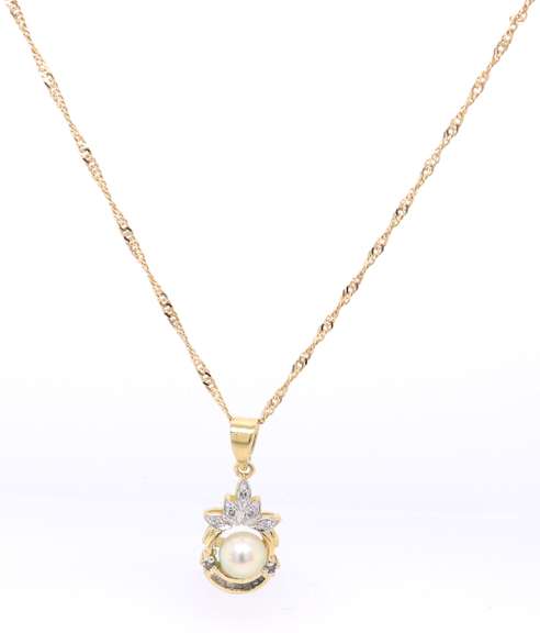 Delightful Yellow Gold Pearl and Round and Baguette Diamond pendant on Chain