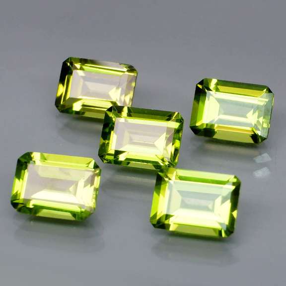 Emerald cut Unheated! 7.65ct Peridot set