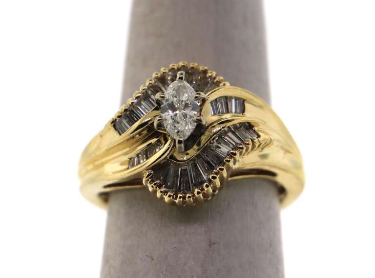 Amazing Oval Diamond Ring surrounded by Baguette Diamonds on a 14k Gold Band