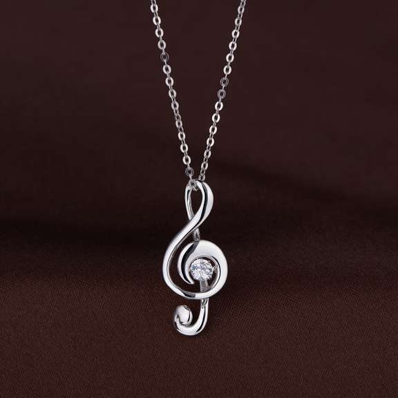 solid sterling silver and dancing simulated diamond musical note pendant