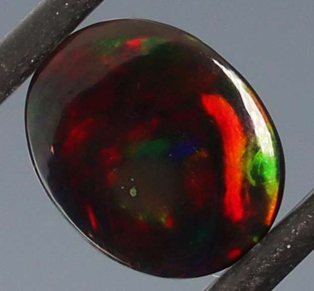 Tremendous 2.46ct red and green flashing Black Opal