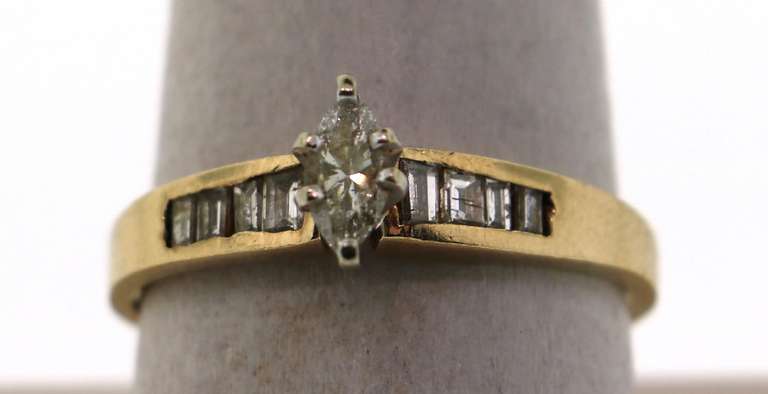 Classic Solitaire 14k Gold Diamond Ring with channel set Baguette Diamond