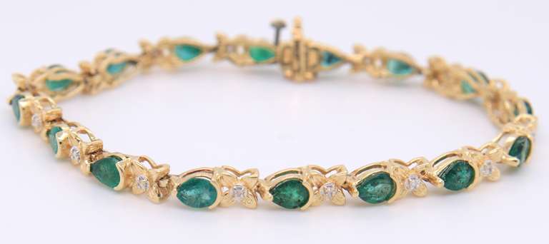 Attractive Yellow Gold Emerald and Diamond Tennis Bracelet