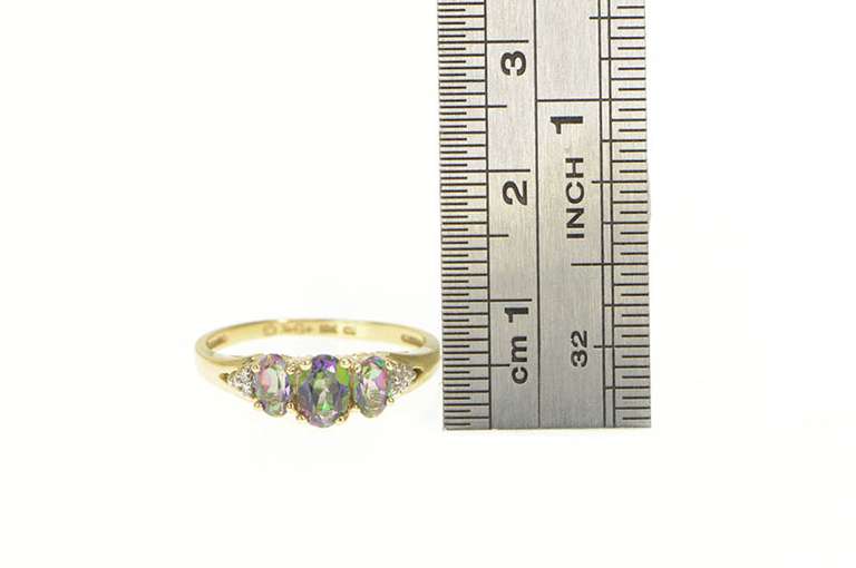 10K Yellow Gold Three Stone Oval Mystic Topaz CZ Accent Ring