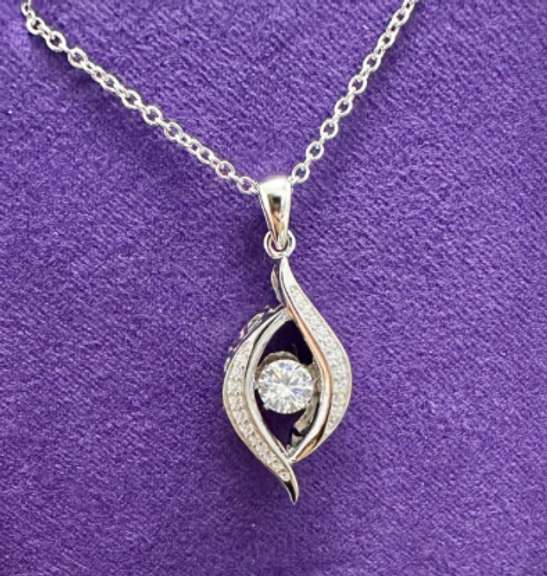 Platinum over 925 non Tarnish Sterling Silver with dancing simulated Stone