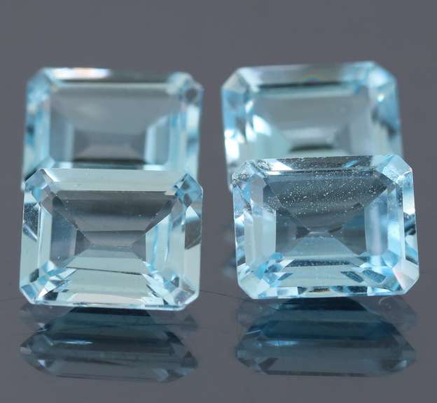 Large 15.32ct vivid sky blue Topaz set