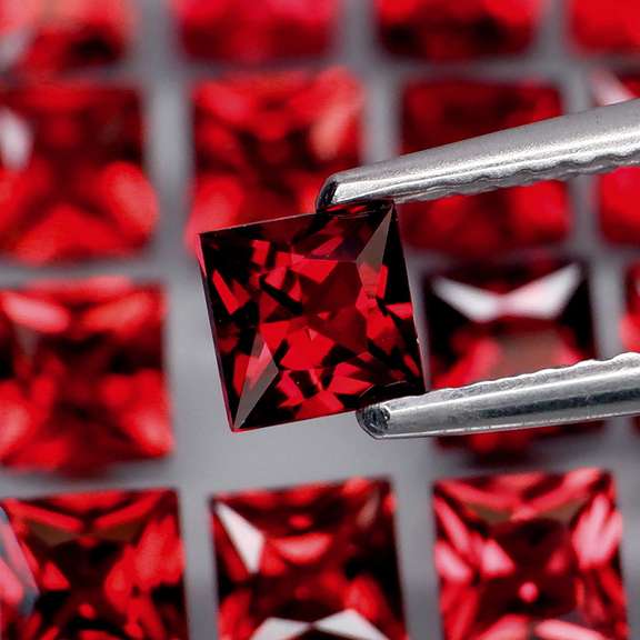 Tremendous 7.46ct princess cut cherry red Garnet set