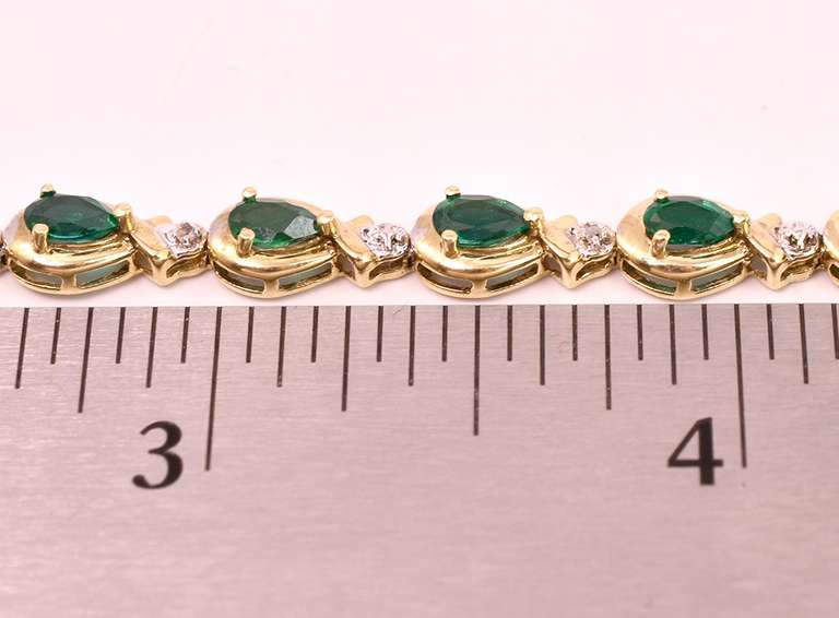 Darling Emerald and Diamond Ring in Yellow Gold