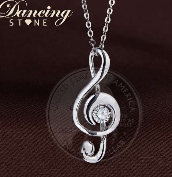 solid sterling silver and dancing simulated diamond musical note pendant
