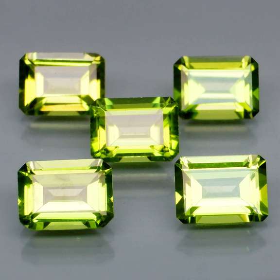 Emerald cut Unheated! 7.65ct Peridot set