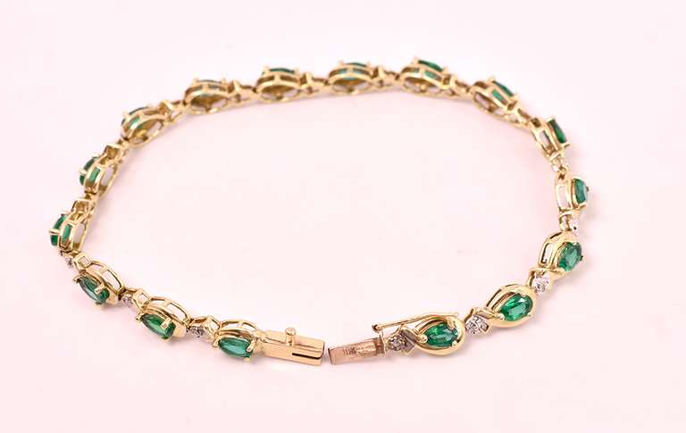 Darling Emerald and Diamond Ring in Yellow Gold