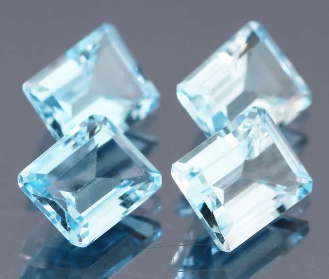 Large 15.64ct vivid blue emerald cut Topaz set