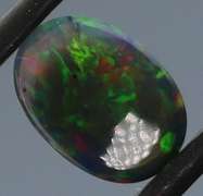 Glistening 1.63ct fiery flashing Welo Black Opal