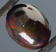 Tremendous 2.46ct red and green flashing Black Opal