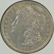 Key date 1897-O Morgan Silver Dollar in nice lustrous AU
