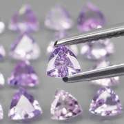Glittering 3.57ct trillion cut Tanzanite set