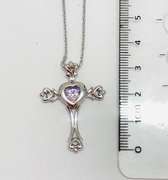 Platinum over 925 non Tarnish sterling silver Pendant with center dancing stone.