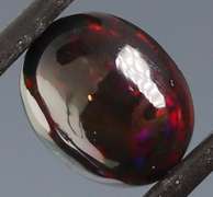 Tremendous 2.46ct red and green flashing Black Opal