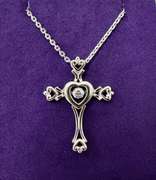 Platinum over 925 non Tarnish sterling silver Pendant with center dancing stone.