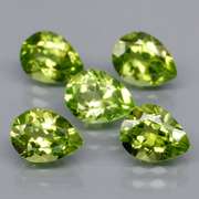 Dazzling 6.02ct untreated apple green Peridot set