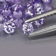 Heavy flashing 4.44ct diamond cut Tanzanite set