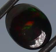 Tremendous 2.46ct red and green flashing Black Opal