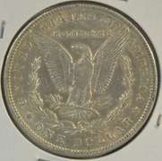 Key date 1897-O Morgan Silver Dollar in nice lustrous AU