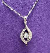 Platinum over 925 non Tarnish Sterling Silver with dancing simulated Stone