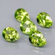 Dazzling 6.18ct untreated apple green Peridot set