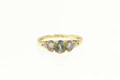 10K Yellow Gold Three Stone Oval Mystic Topaz CZ Accent Ring