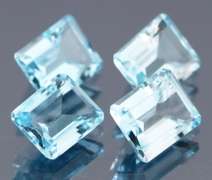 Large 15.64ct vivid blue emerald cut Topaz set