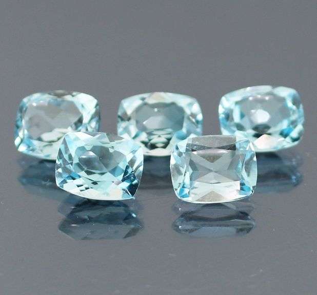 Dazzling 8.58ct vivid blue cushion cut Topaz set