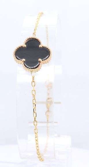 Black onyx clover bracelet in 14kt yellow gold