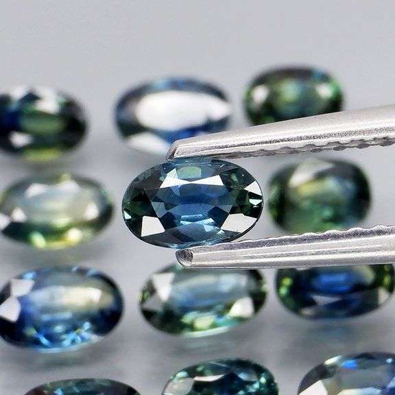 Heated only! 4.99ct blue green sapphire set
