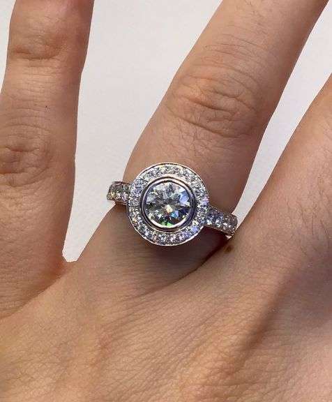 VINTAGE AND TIMELESS 14K WHITE GOLD BEZEL SET HALO DIAMOND ENGAGEMENT RING