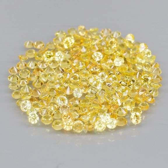 Fantastic 4.71ct diamond cut yellow Sapphire set